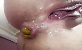 Close up of shaved babe shitting