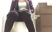 Big ass babe shits over toilet
