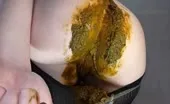 She smears liquid shit on shaved pussy