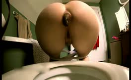 Hot schoolgirl shitting over toilet