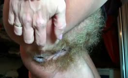 Hairy babe shits in close up