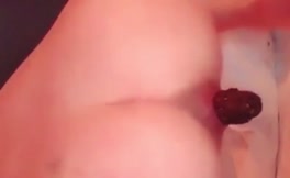 Close up of a sexy babe shitting